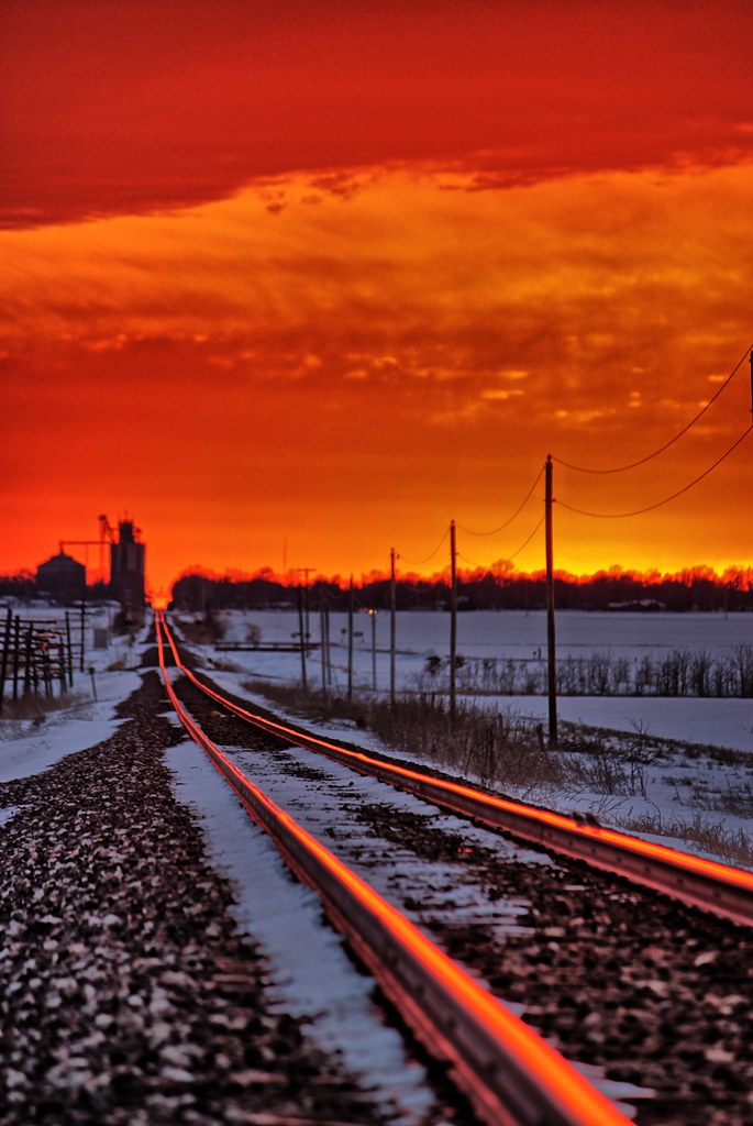 Witness the annual miracle as the sun’s mesmerizing reflection dances upon the railroad tracks, inviting you to capture a photograph that encapsulates the enchantment of this fleeting moment in time.vouyen