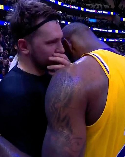 Luka Doncic and LeBron James hug each other after the game