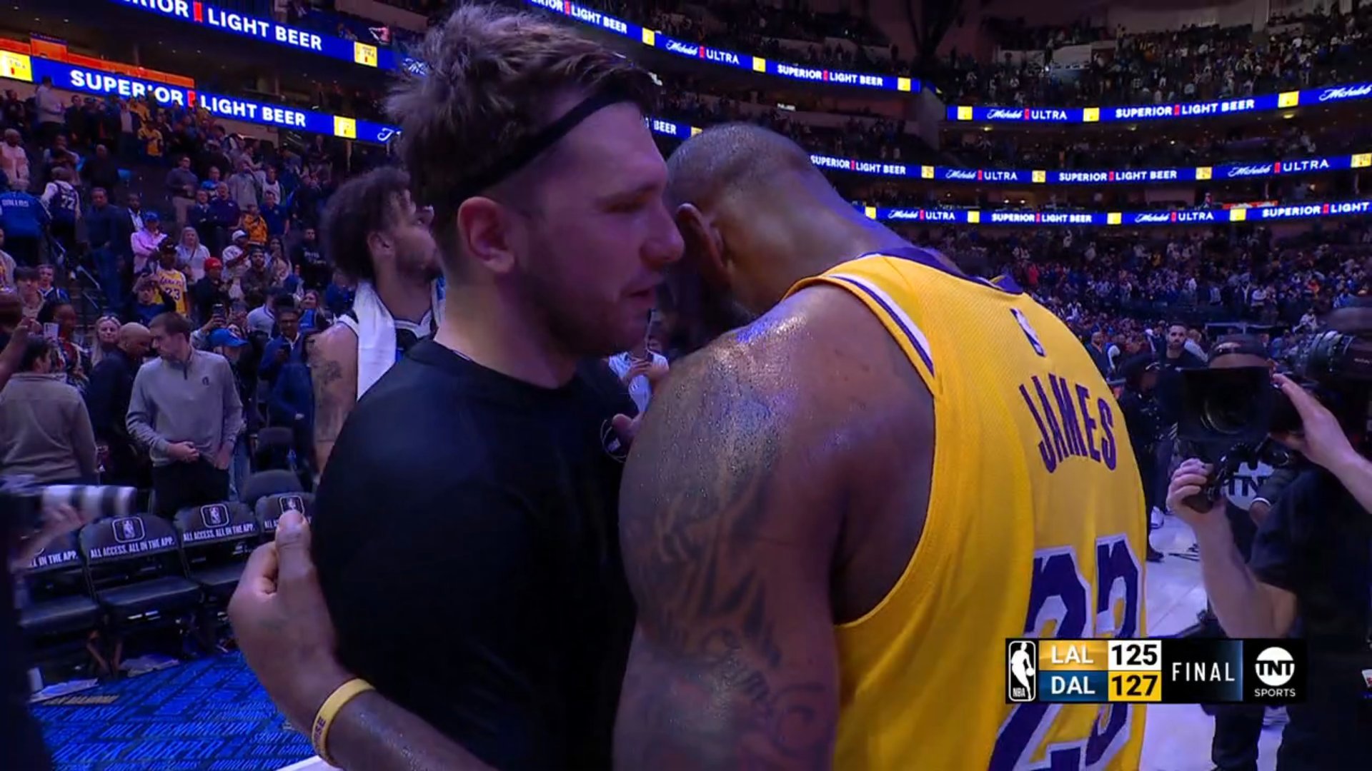 Luka Doncic and LeBron James hug each other after the game